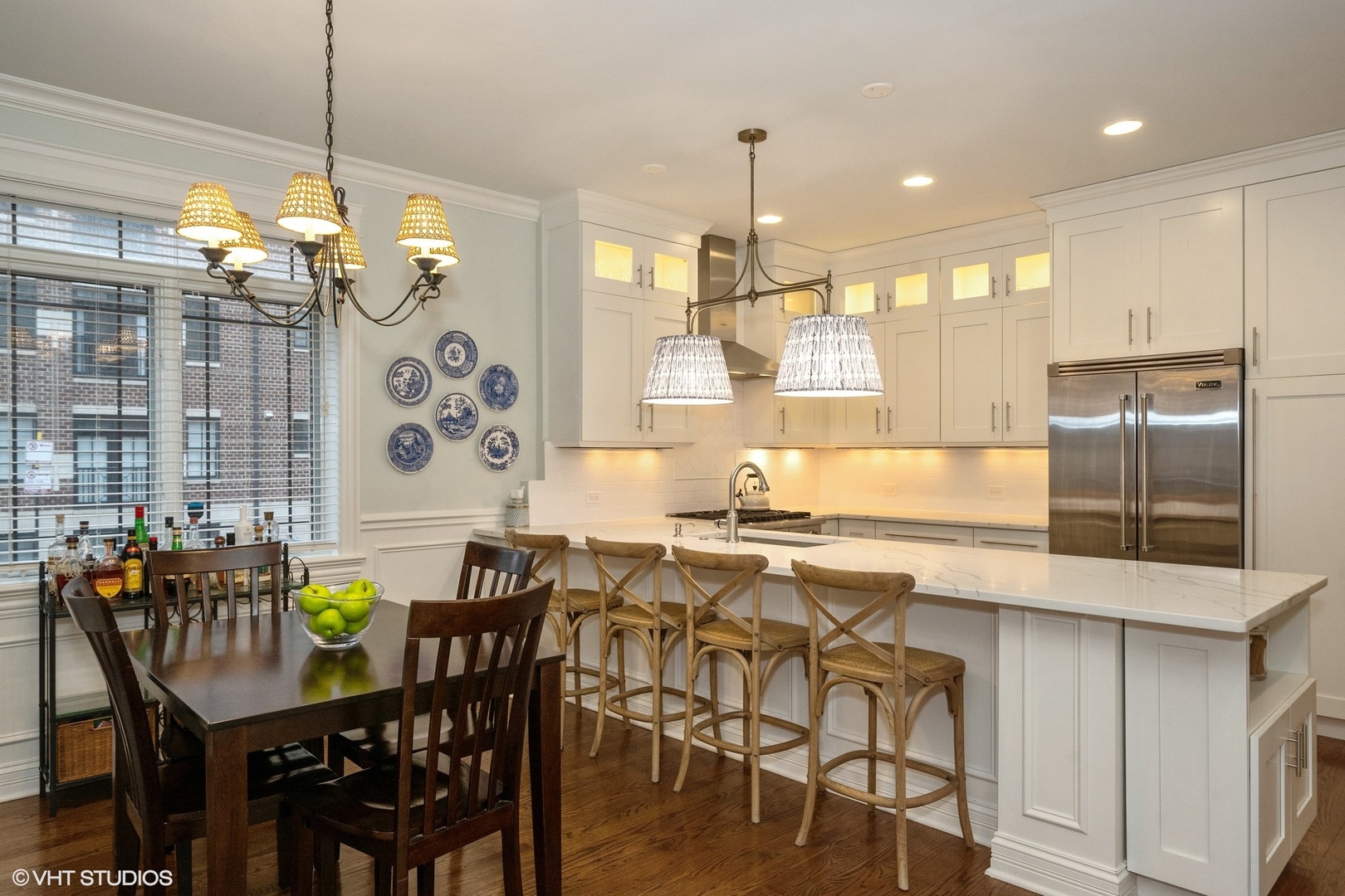 858 West Diversey Parkway, Unit 1W Chicago, IL 60614 - Photo 5 of 20 a kitchen with stainless steel appliances granite countertop a table chairs stove and refrigerator