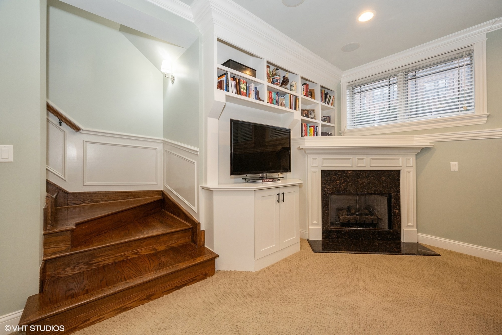 858 West Diversey Parkway, Unit 1W Chicago, IL 60614 - Photo 7 of 20 a living room with fireplace furniture a flat screen tv and a ceiling fan