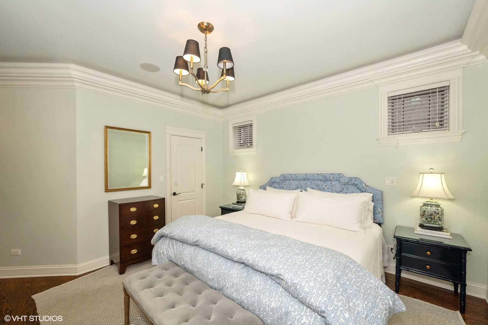858 West Diversey Parkway, Unit 1W Chicago, IL 60614 - Photo 10 of 20 a bedroom with a bed and a chandelier