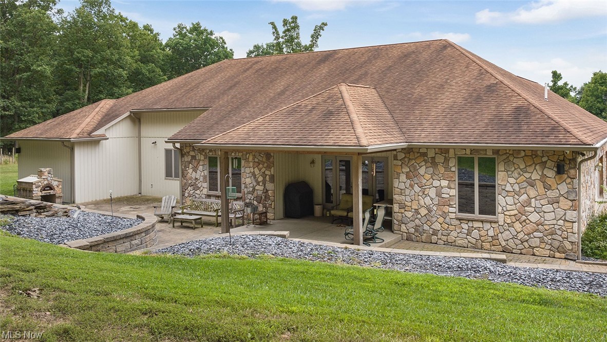 57430 Ohio Riverview Road Shadyside, OH 43947 - Photo 27 of 35 View of back of house featuring a patio with a brick fire pizza oven