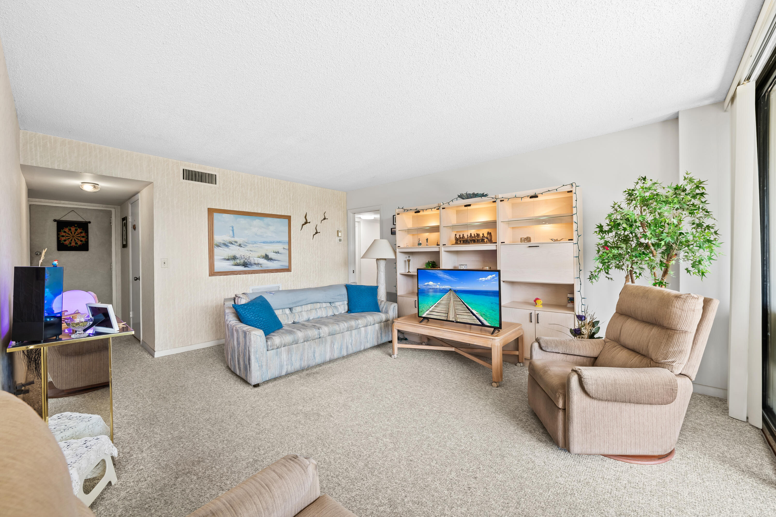 799 Jeffery Street, Unit 4050 Boca Raton, FL 33487 - Photo 12 of 39 a living room with furniture and a couch