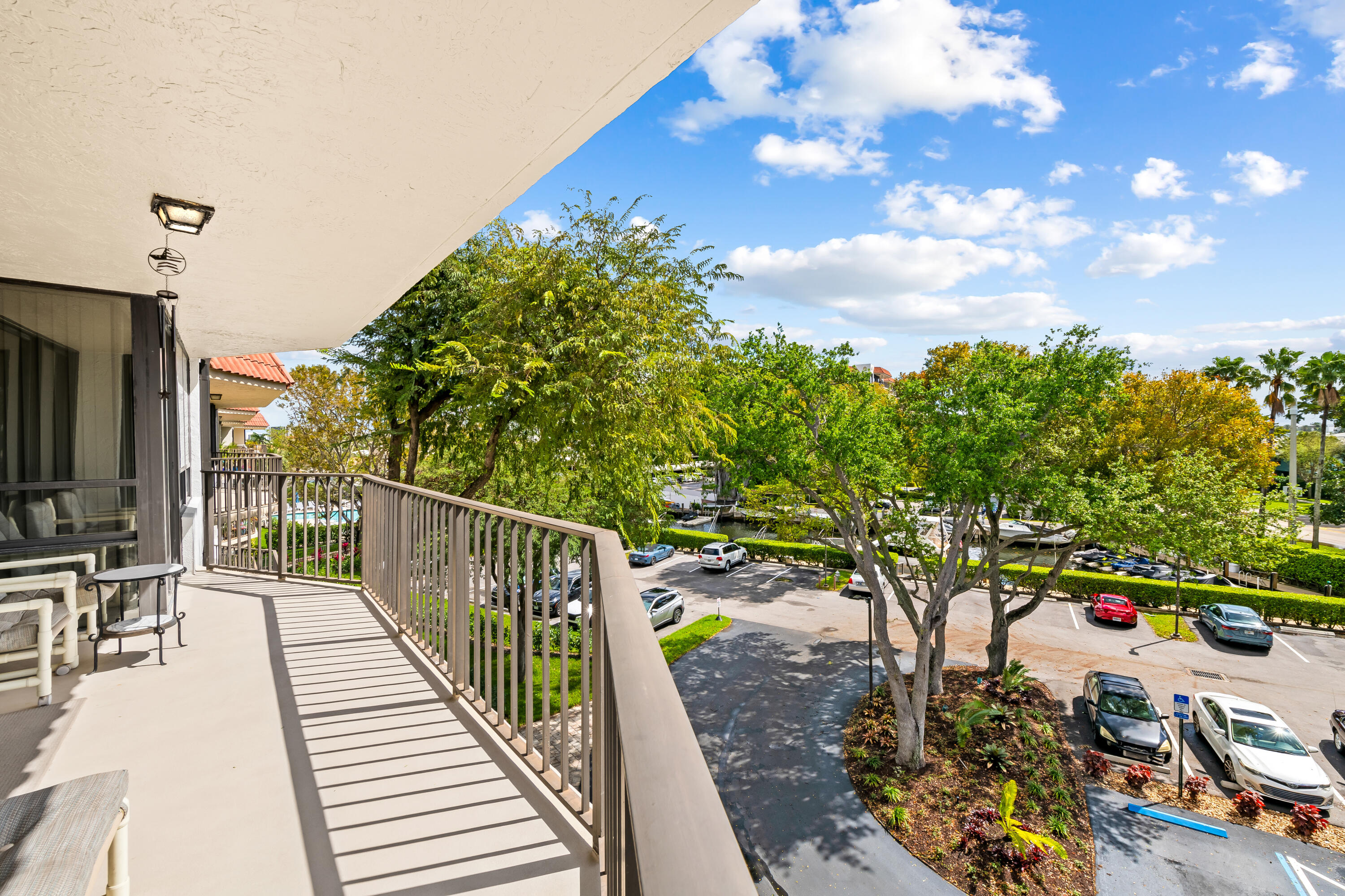 799 Jeffery Street, Unit 4050 Boca Raton, FL 33487 - Photo 2 of 39 a balcony with wooden floor and city view