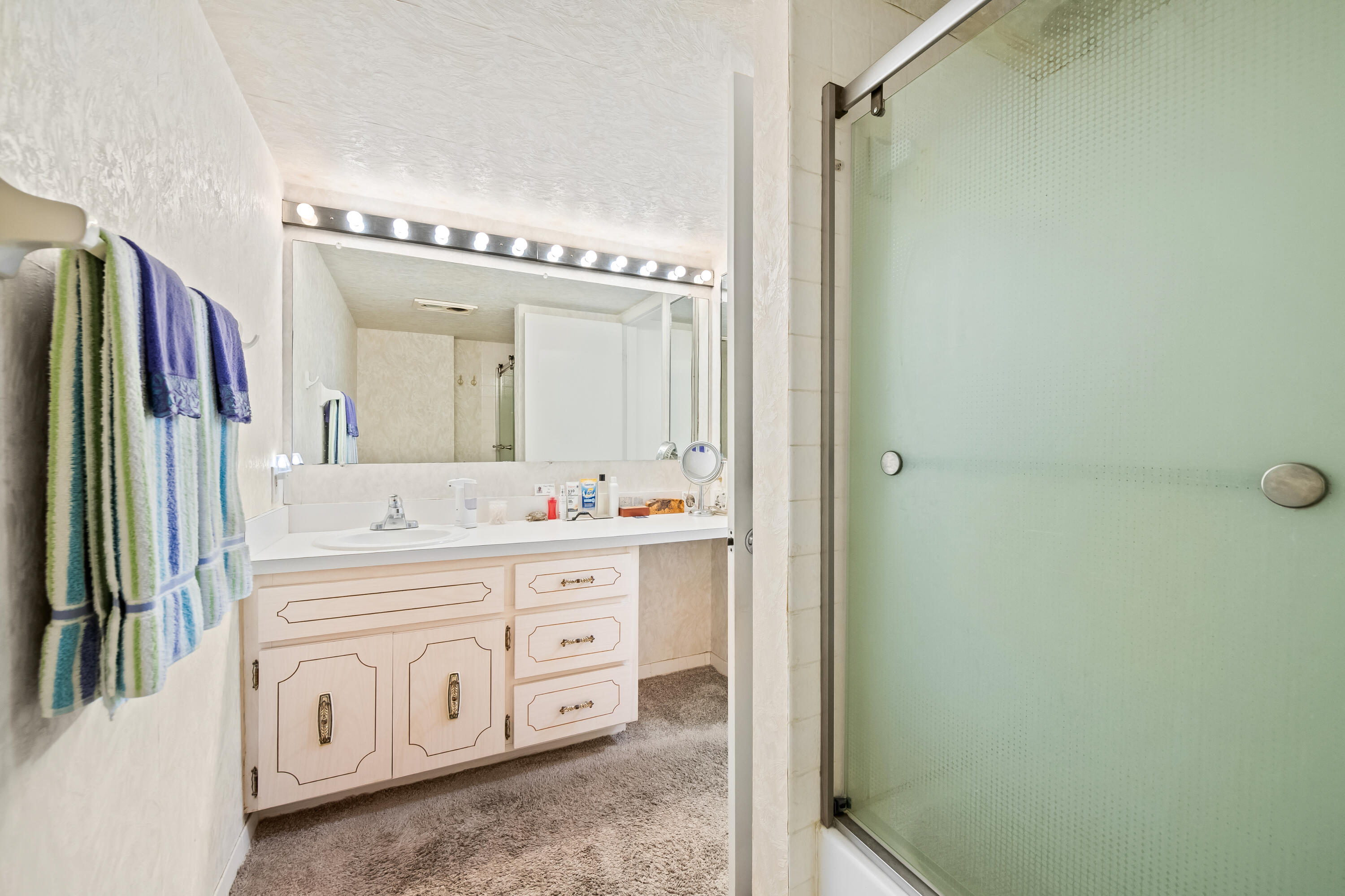 799 Jeffery Street, Unit 4050 Boca Raton, FL 33487 - Photo 21 of 39 a bathroom with a double vanity sink and mirror