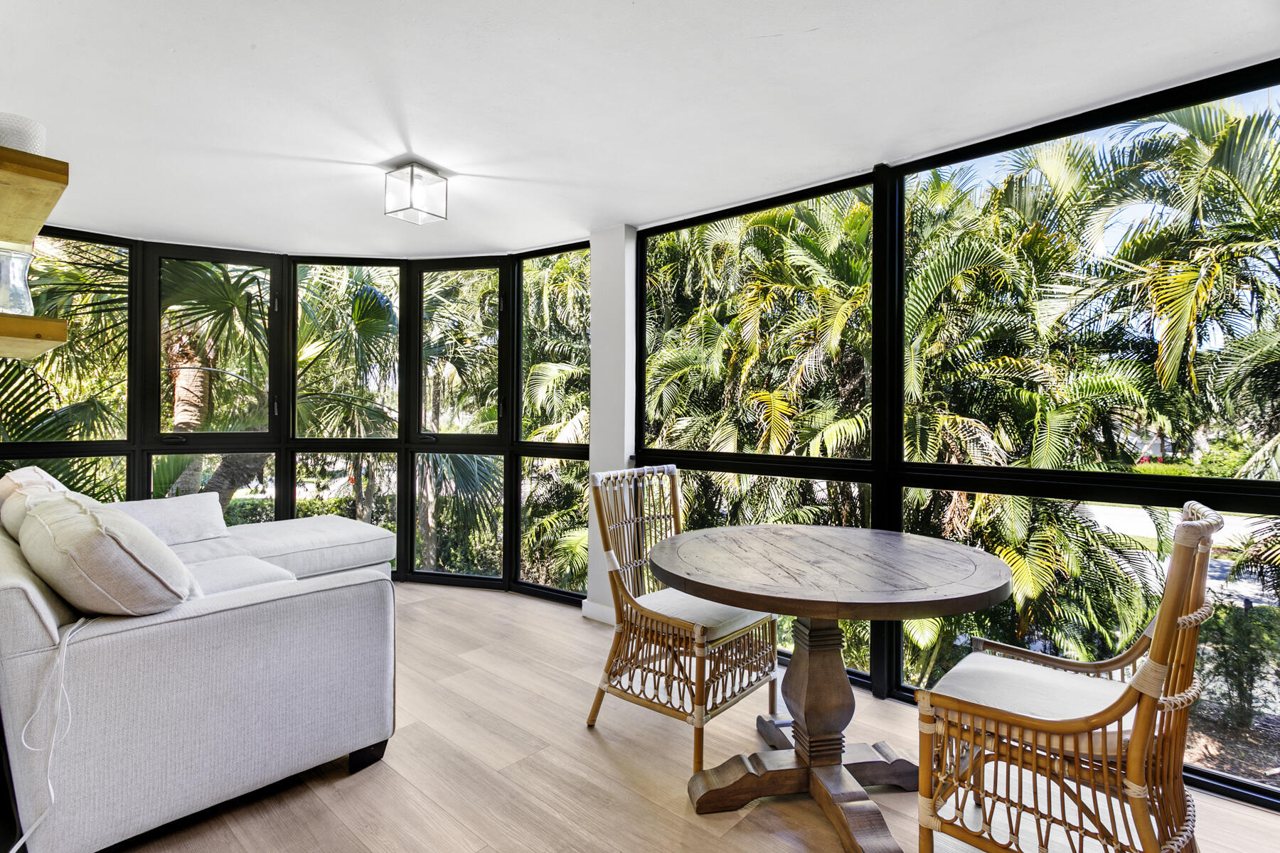 17137 Waterbend Drive, Unit 201 Jupiter, FL 33477 - Photo 1 of 43 a living room with furniture and a large window