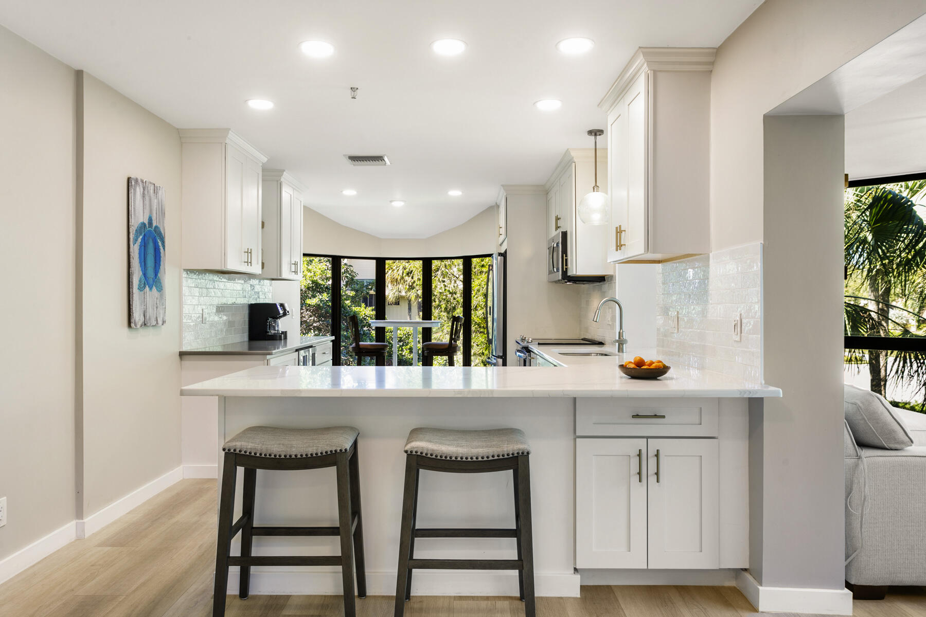 17137 Waterbend Drive, Unit 201 Jupiter, FL 33477 - Photo 17 of 43 a kitchen with stainless steel appliances a sink and cabinets