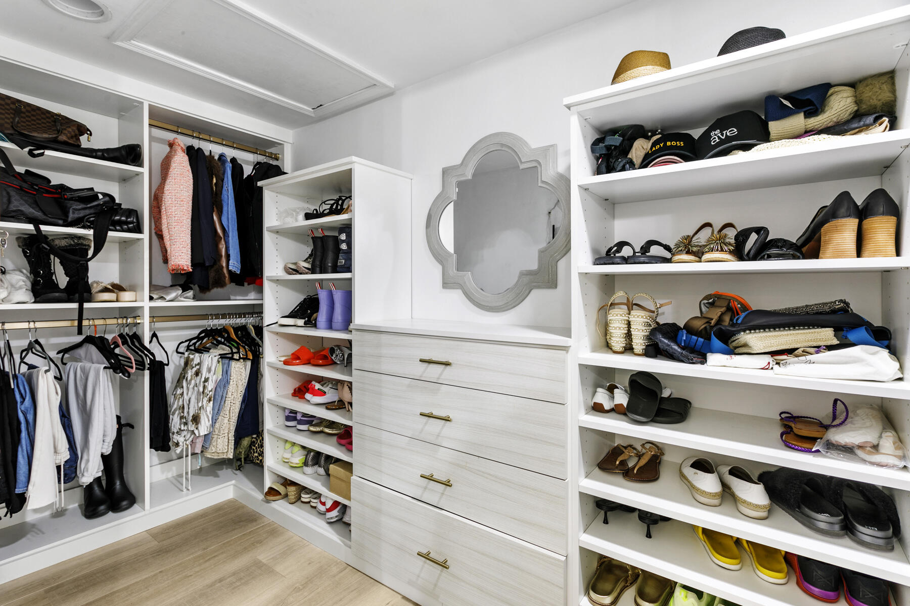 17137 Waterbend Drive, Unit 201 Jupiter, FL 33477 - Photo 20 of 43 a view of walk in closet with clothes and shoes