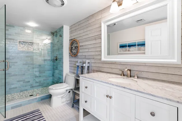 a bathroom with a bathtub and a toilet