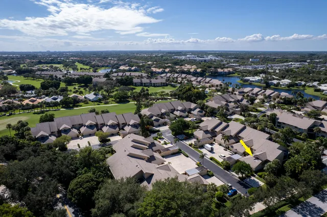an aerial view of a house with a swimming pool outdoor seating and yard