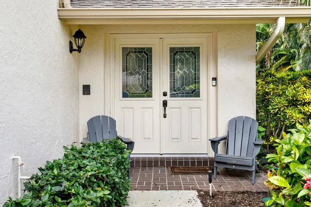 a front view of a house with entryway and wooden floor