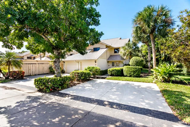 an aerial view of a house with a garden