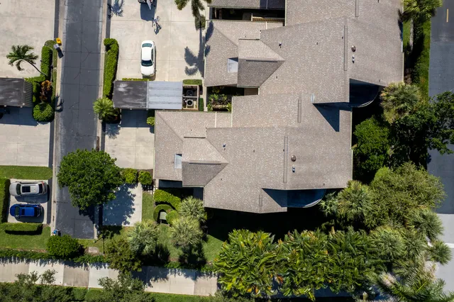 an aerial view of residential houses with city view