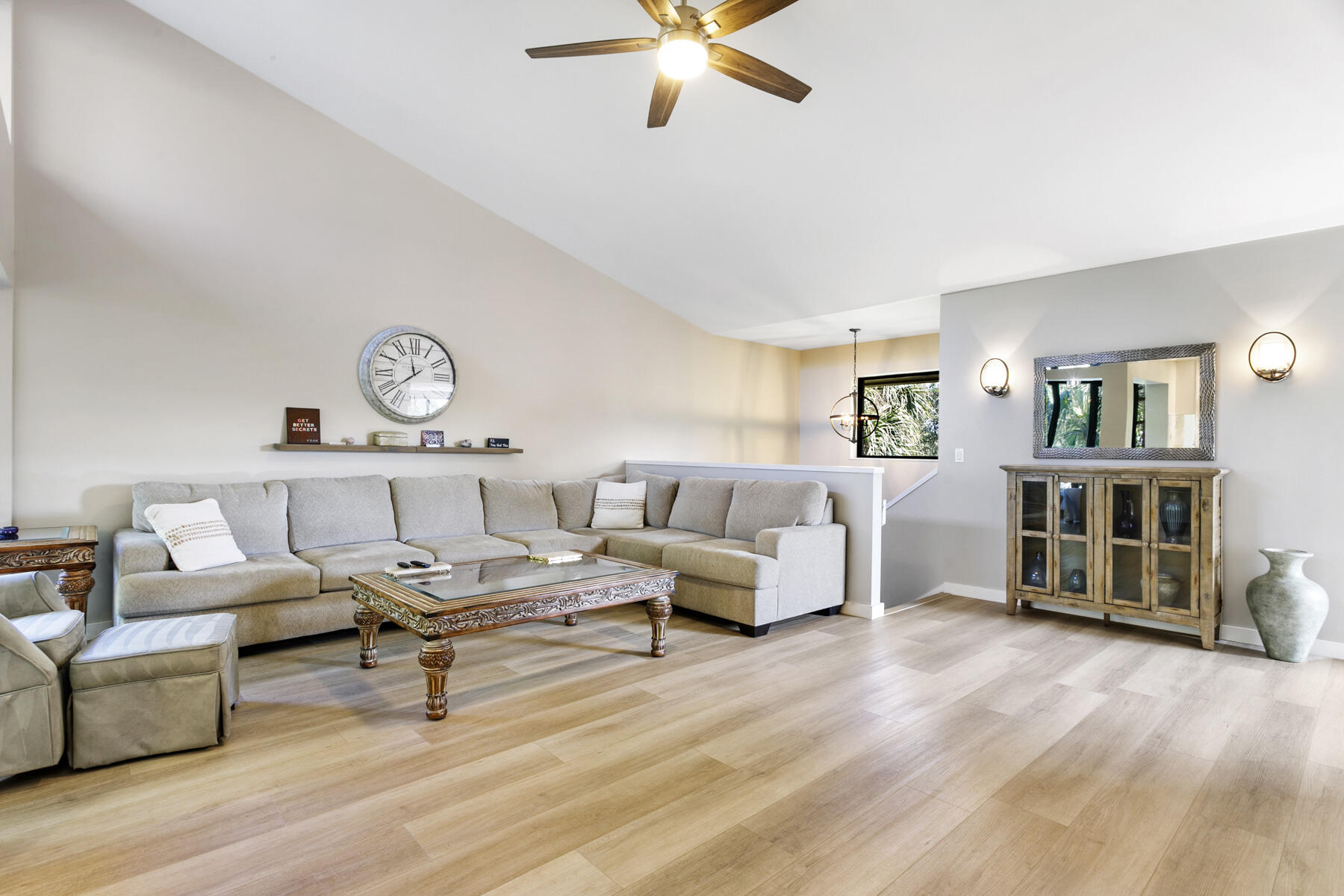 17137 Waterbend Drive, Unit 201 Jupiter, FL 33477 - Photo 5 of 43 a living room with furniture and a wooden floor