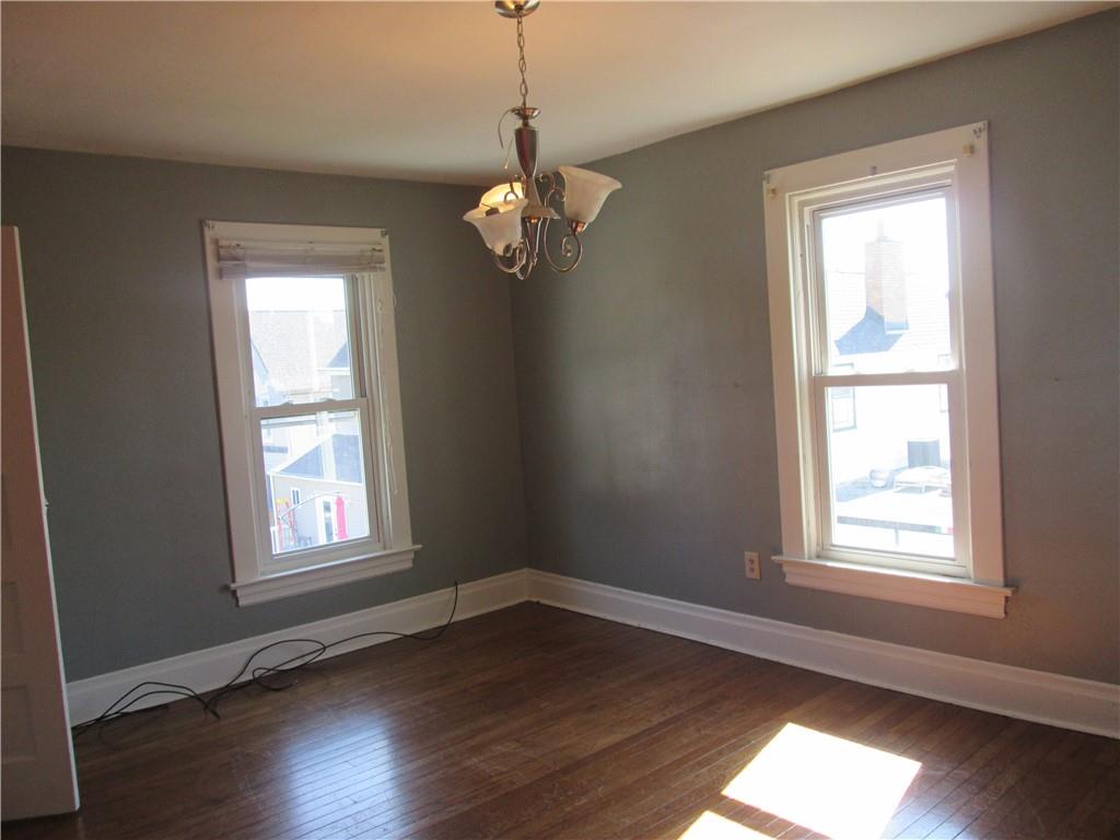361 Reno Street Rochester, PA 15074 - Photo 14 of 21 a view of an empty room with wooden floor and a window