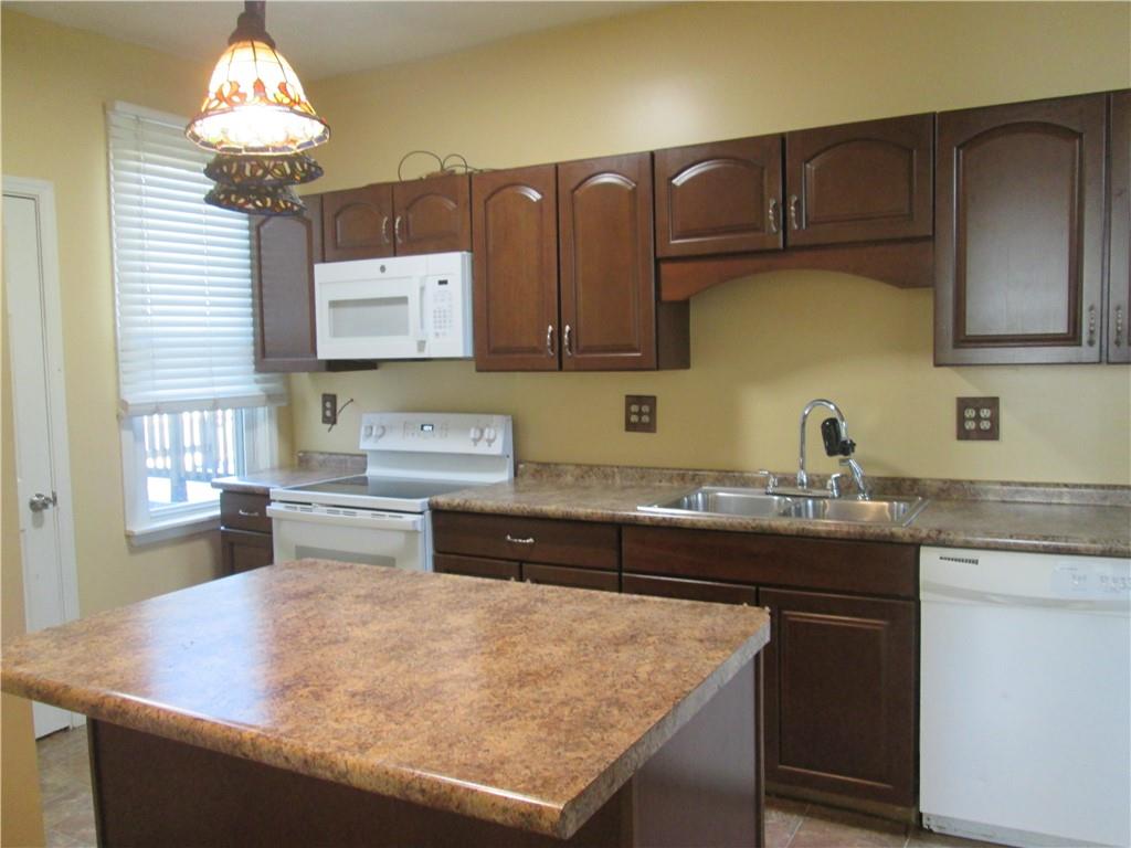 361 Reno Street Rochester, PA 15074 - Photo 7 of 21 a kitchen with a sink a stove and cabinets