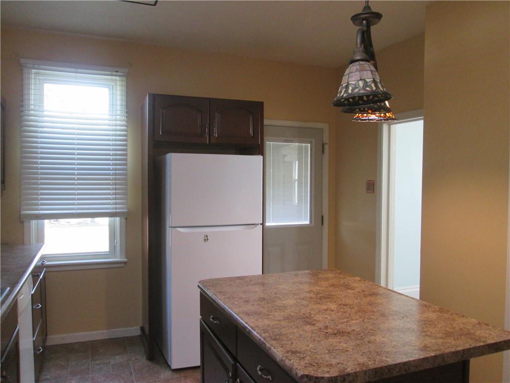 361 Reno Street Rochester, PA 15074 - Photo 9 of 21 a dining room with a table and chairs