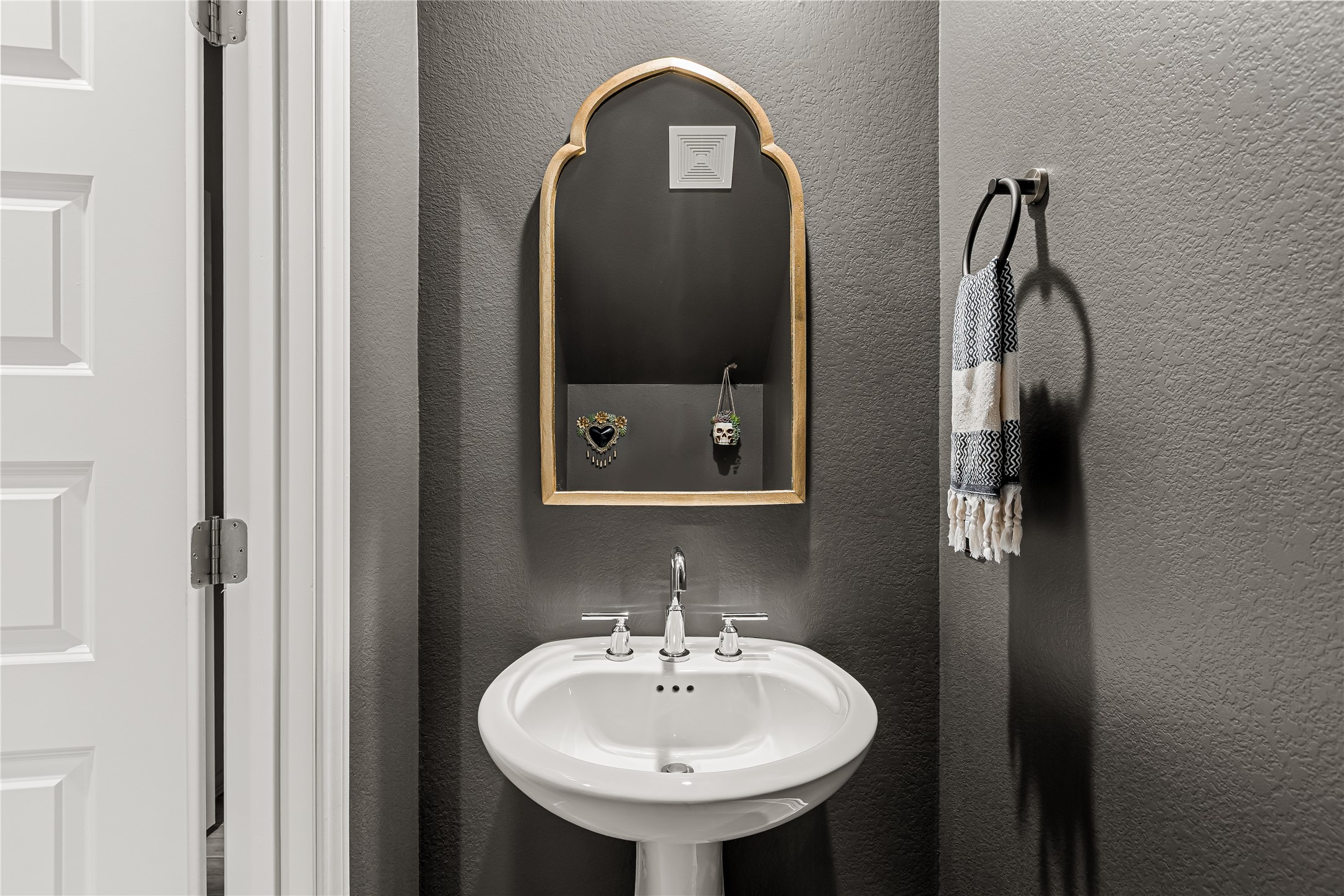 862 Pepperbark Loop Buda, TX 78610 - Photo 23 of 40 a bathroom with a sink and a mirror