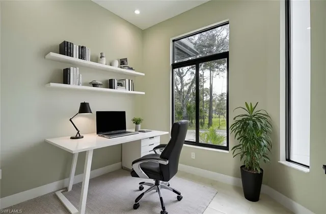 a bedroom with a bed and a potted plant