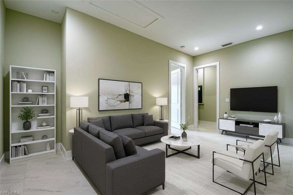 219 33rd Avenue Northwest Naples, FL 34120 - Photo 21 of 41 a living room with furniture and a flat screen tv