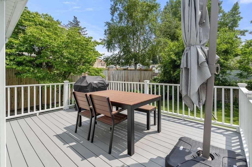 92 Oakdale Road Newton, MA 02459 - Photo 18 of 21 a view of a wooden deck with furniture