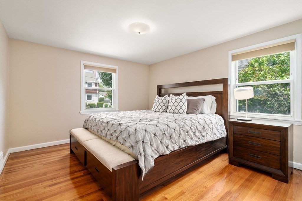 92 Oakdale Road Newton, MA 02459 - Photo 10 of 21 a bed sitting in a bedroom next to a window