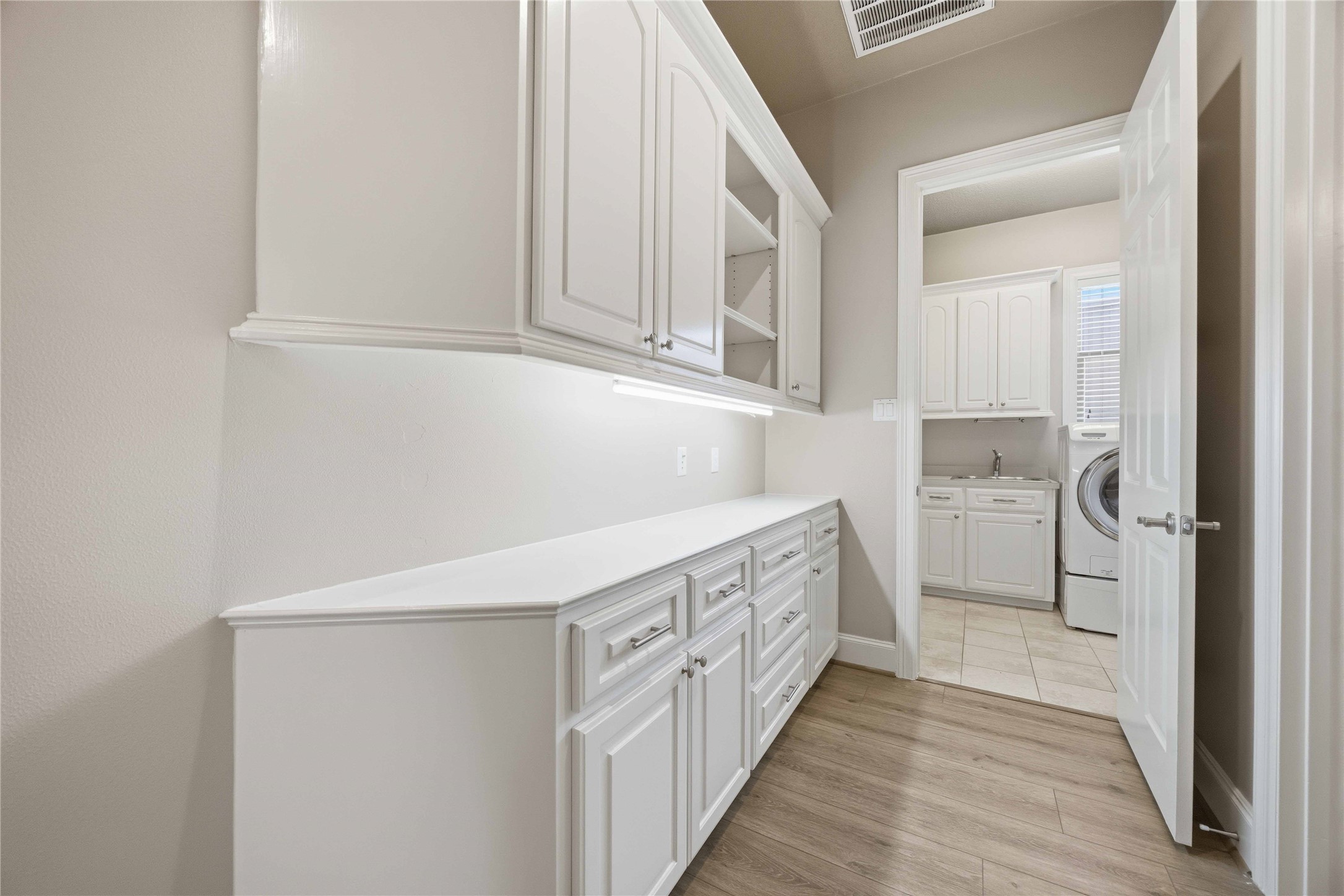 1930 Old River Road Montgomery, TX 77356 - Photo 18 of 49 A butler's pantry, located behind the kitchen, offers additional prep space and storage space. It leads to the utility room.