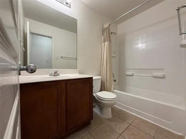 a bathroom with a sink toilet a mirror and shower