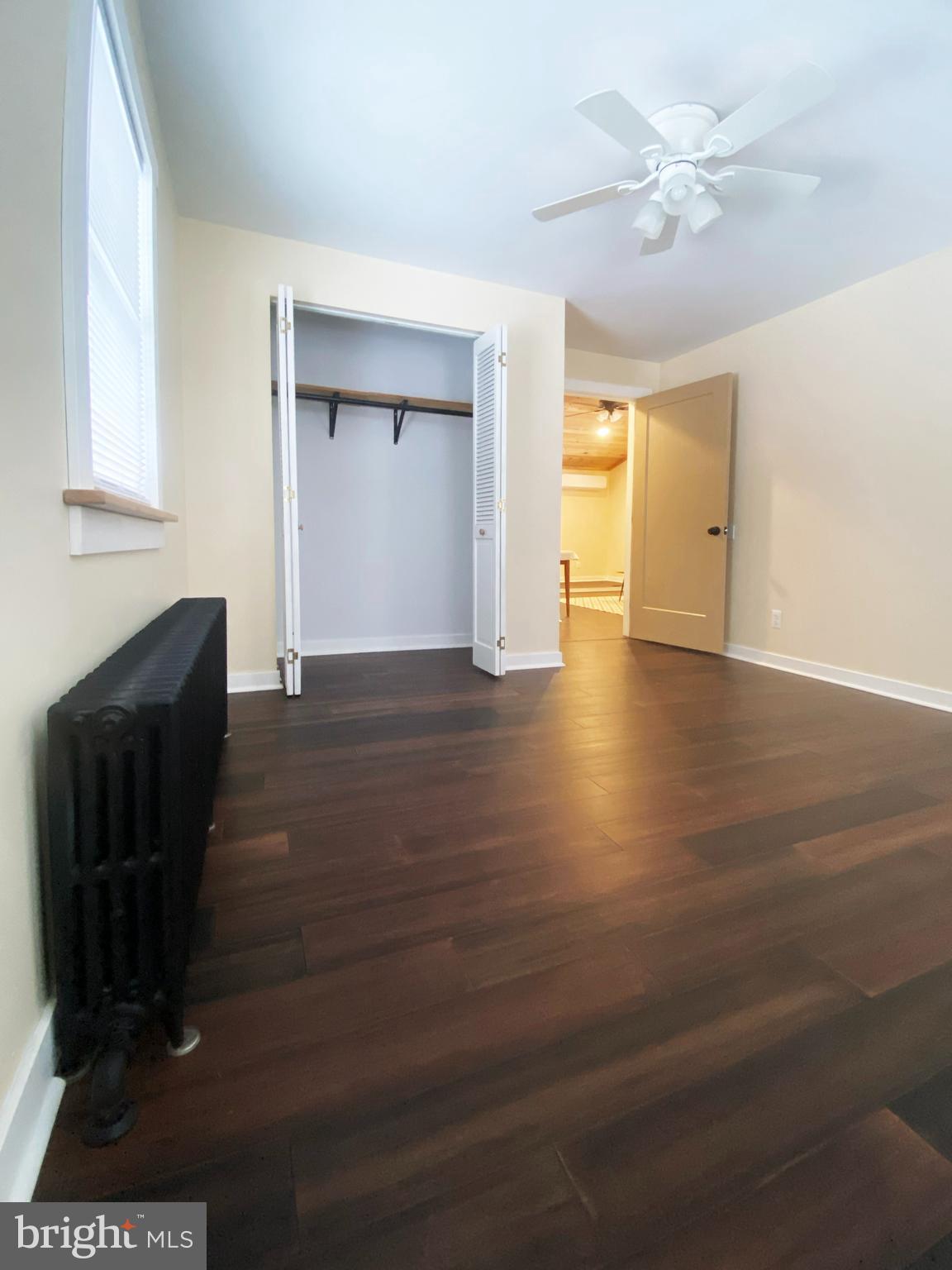 1978 Leithsville Road Hellertown, PA 18055 - Photo 20 of 24 a view of an empty room with wooden floor and a window