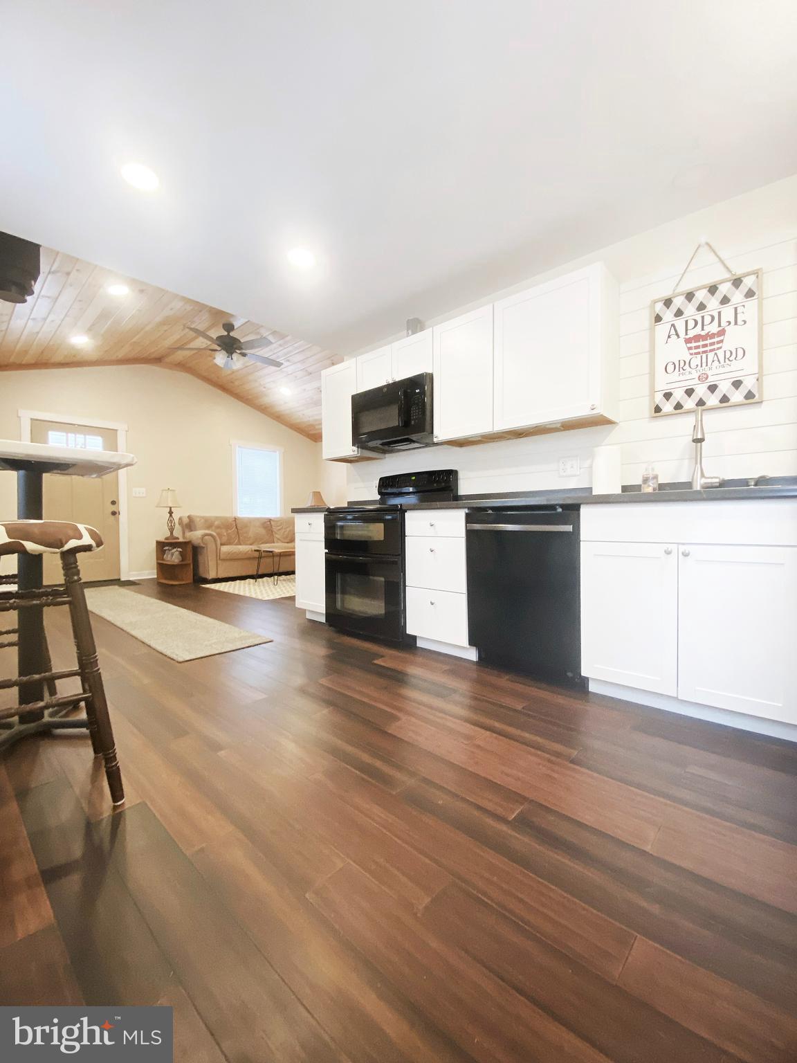 1978 Leithsville Road Hellertown, PA 18055 - Photo 7 of 24 a kitchen with stainless steel appliances kitchen island granite countertop a stove and a wooden floors
