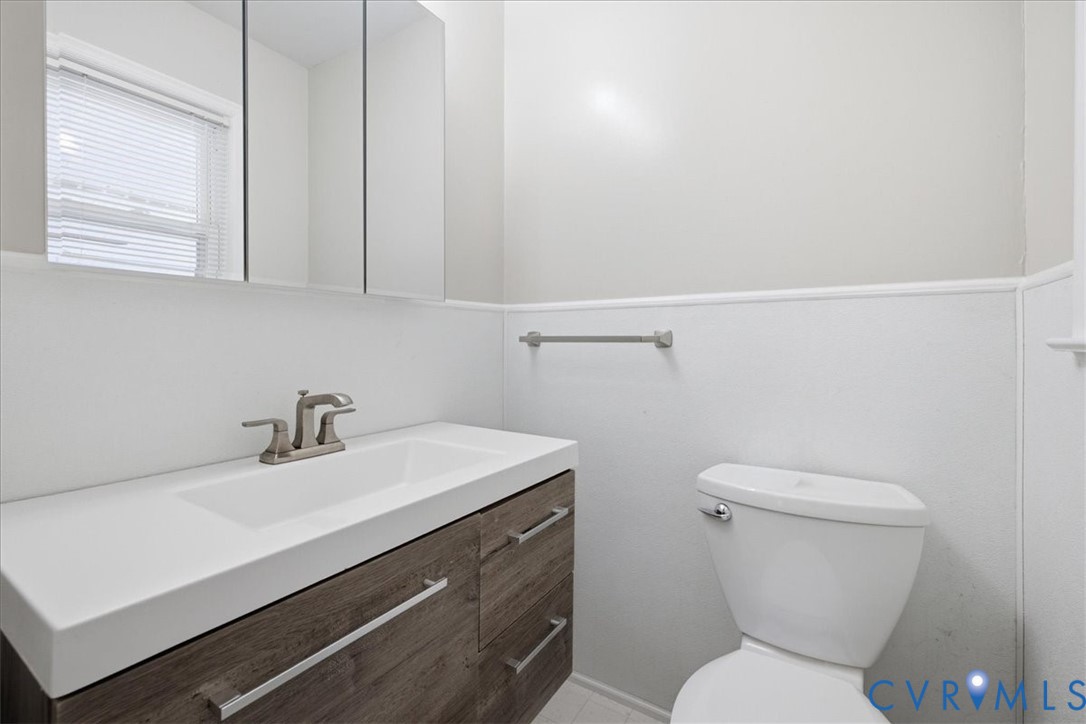404 Bermuda Hundred Road Chester, VA 23836 - Photo 24 of 37 Bathroom vanity featuring a built-in sink, brushed