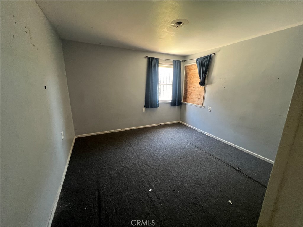 6942 Watcher Street Commerce, CA 90040 - Photo 11 of 14 an empty room with a window