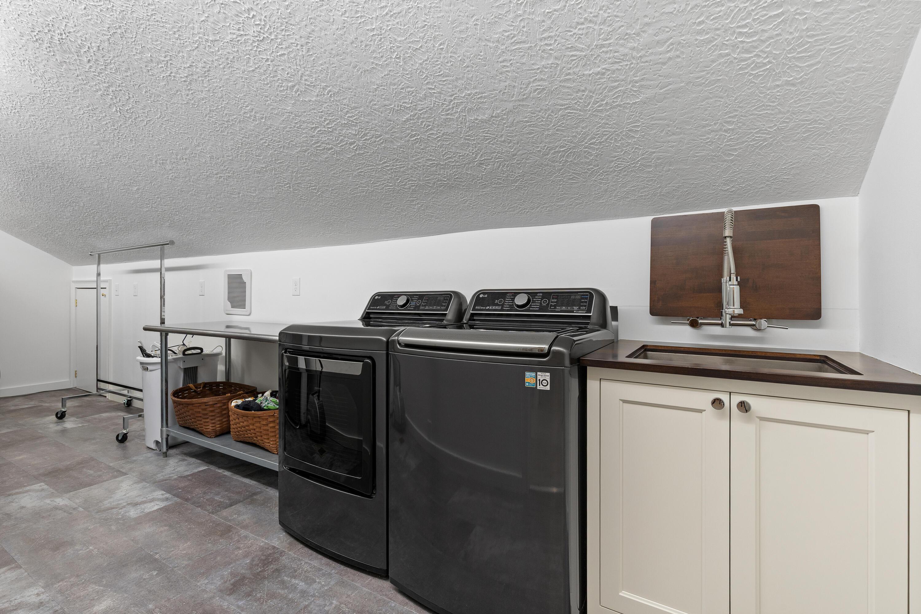 1364 Dale Ford Road Delaware, OH 43015 - Photo 72 of 112 • Vinyl flooring • White painted walls • Wall exhaust • Wall light • Attic access • Utility sink • Pocket door • Electric dryer hookup • Washer & dryer are negotiable