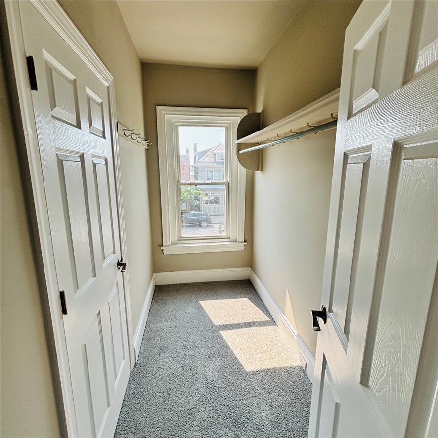 718 Linden Street Bethlehem, PA 18018 - Photo 12 of 19 A well-lit closet offers ample storage with convenient shelving and a window overlooking the neighborhood.