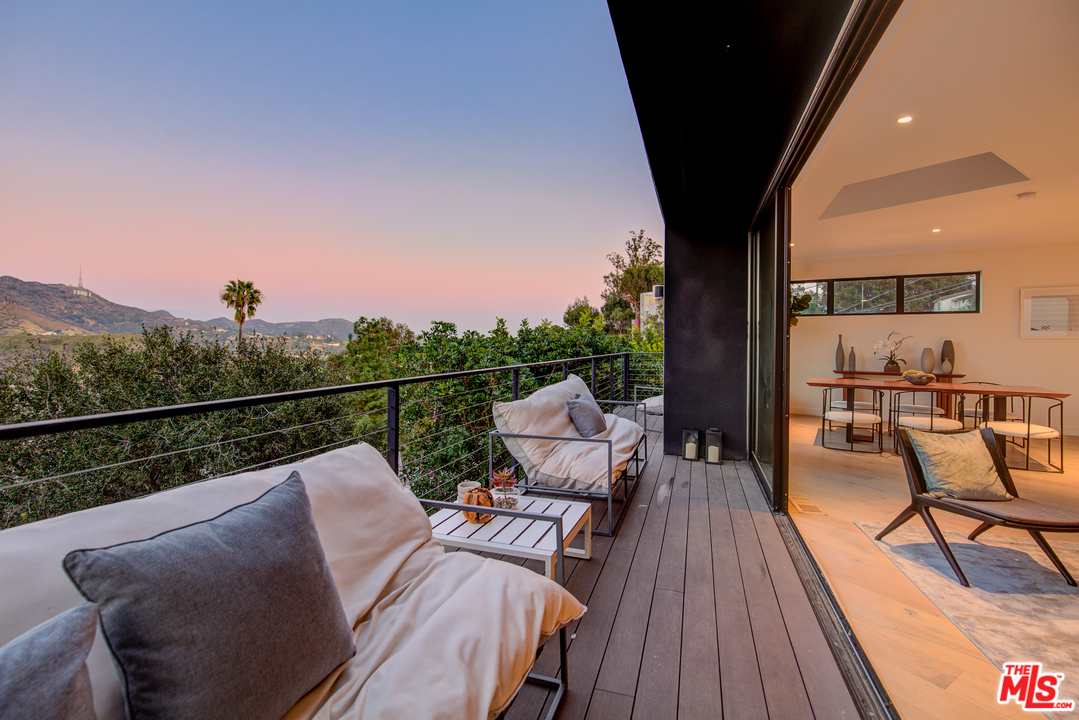 6876 Pacific View Drive Los Angeles, CA 90068 - Photo 11 of 31 a view of deck with furniture and a potted plant