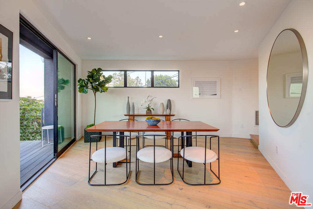 6876 Pacific View Drive Los Angeles, CA 90068 - Photo 12 of 31 a dining room with furniture and window