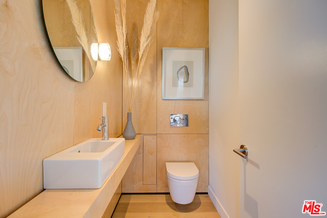6876 Pacific View Drive Los Angeles, CA 90068 - Photo 13 of 31 a bathroom with a sink and a mirror