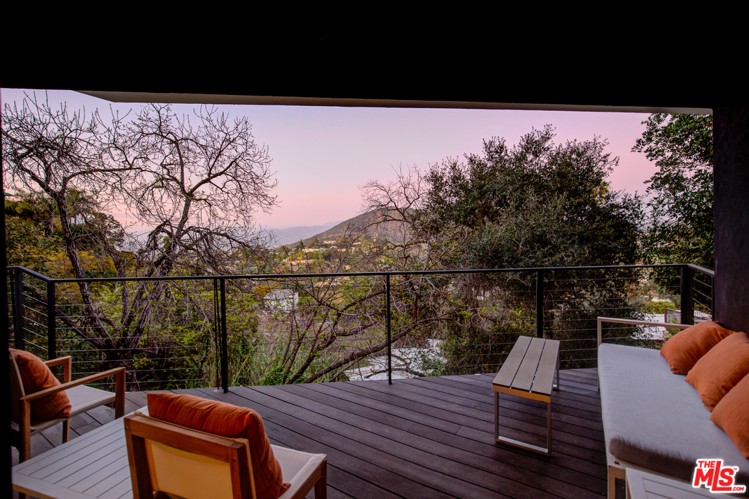 6876 Pacific View Drive Los Angeles, CA 90068 - Photo 23 of 31 a view of roof deck with wooden floor and seating space