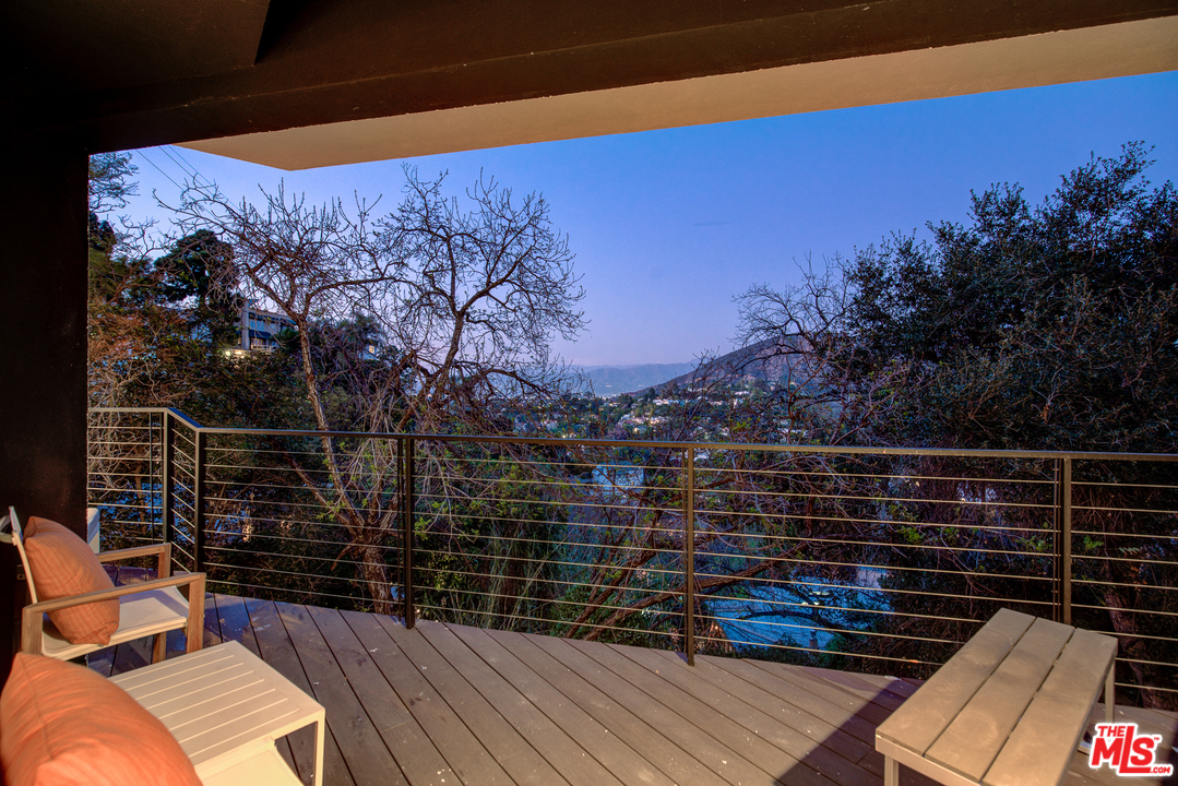 6876 Pacific View Drive Los Angeles, CA 90068 - Photo 30 of 31 a view of balcony with wooden floor and outdoor space