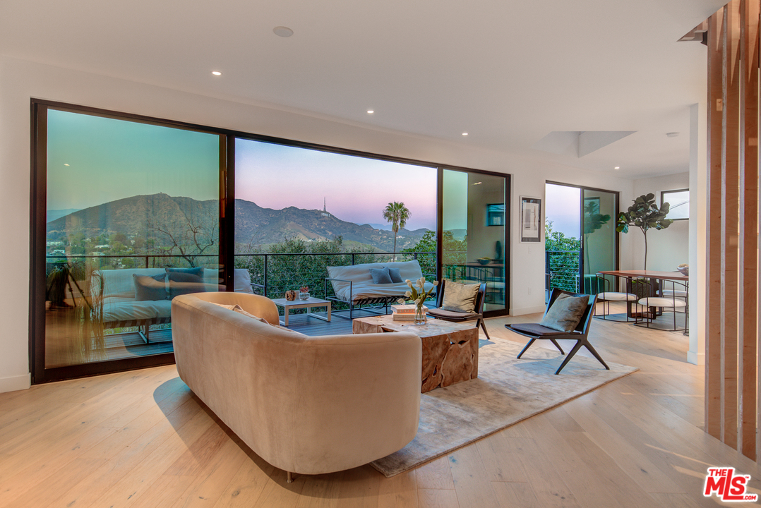 6876 Pacific View Drive Los Angeles, CA 90068 - Photo 5 of 31 a living room with couch and a large window
