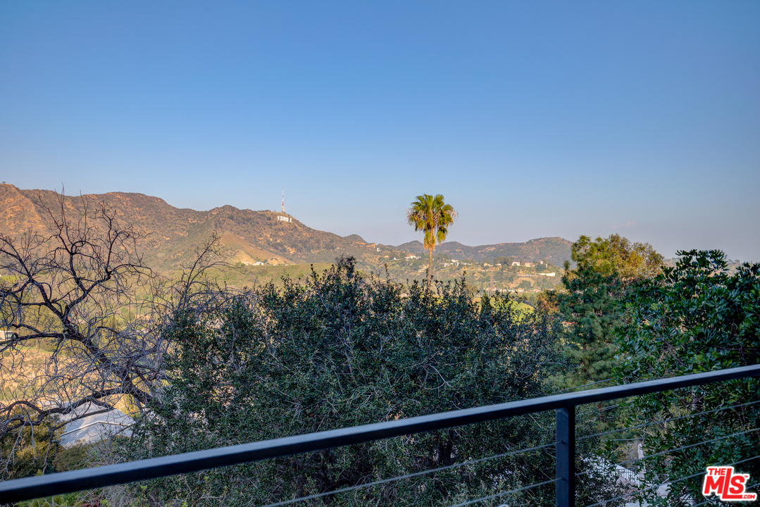 6876 Pacific View Drive Los Angeles, CA 90068 - Photo 6 of 31 a view of a mountain from a balcony