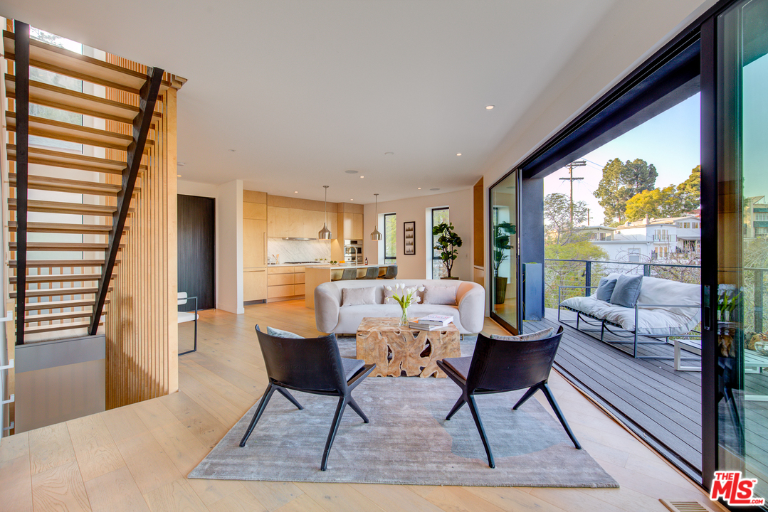 6876 Pacific View Drive Los Angeles, CA 90068 - Photo 7 of 31 a living room with furniture and a large window