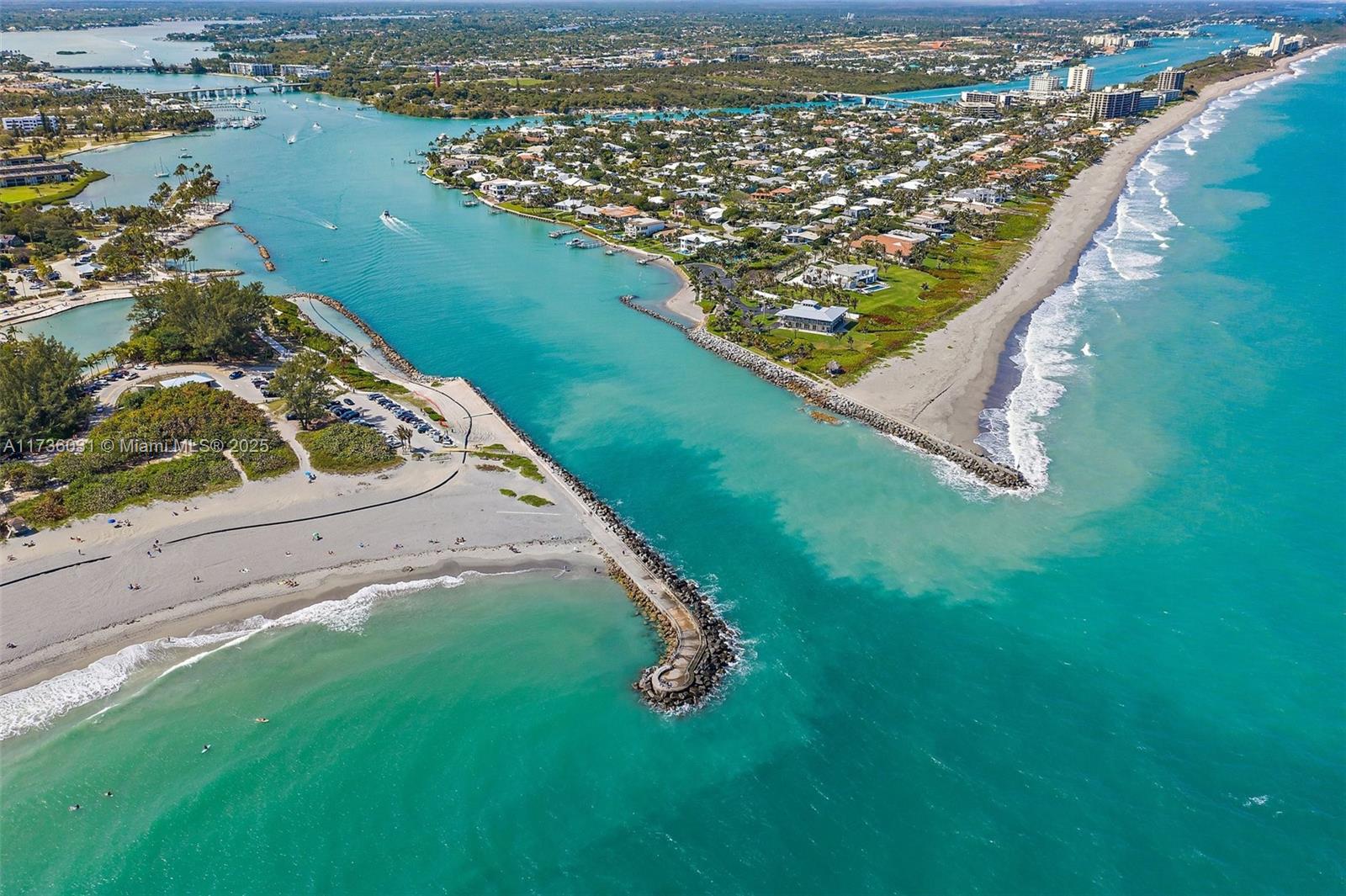 219 Colony Road Jupiter Inlet Colony, FL 33469 - Photo 14 of 17 an aerial view of residential houses with outdoor space and river