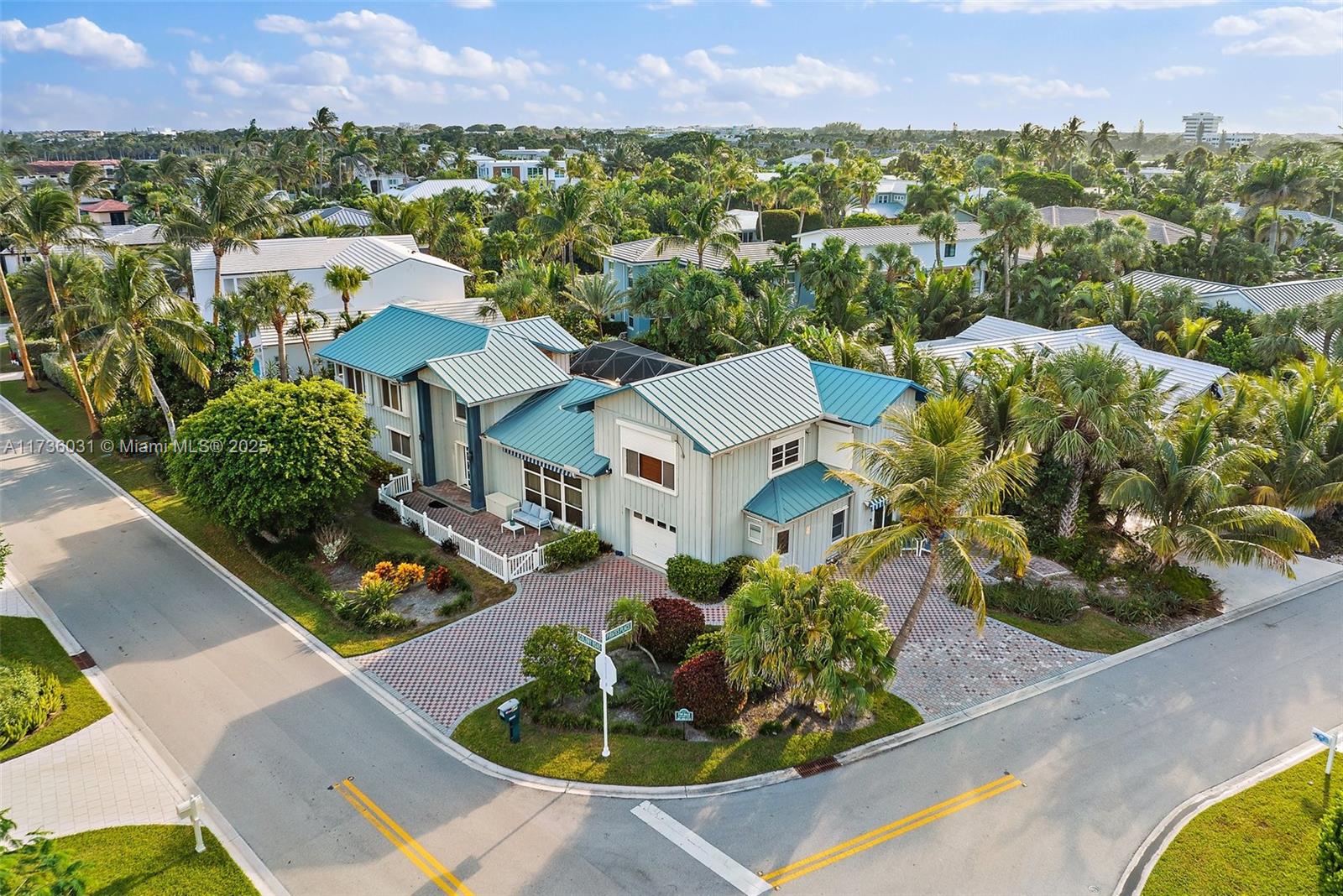 219 Colony Road Jupiter Inlet Colony, FL 33469 - Photo 3 of 17 an aerial view of a house with a garden