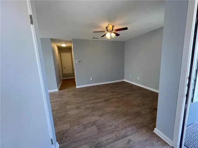a view of a livingroom with wooden floor