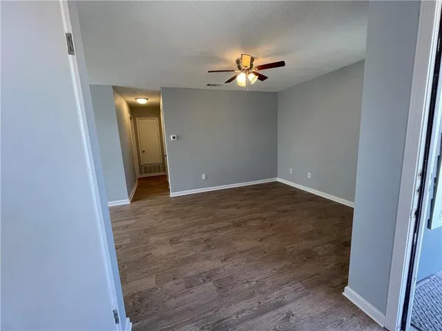 a view of a livingroom with wooden floor