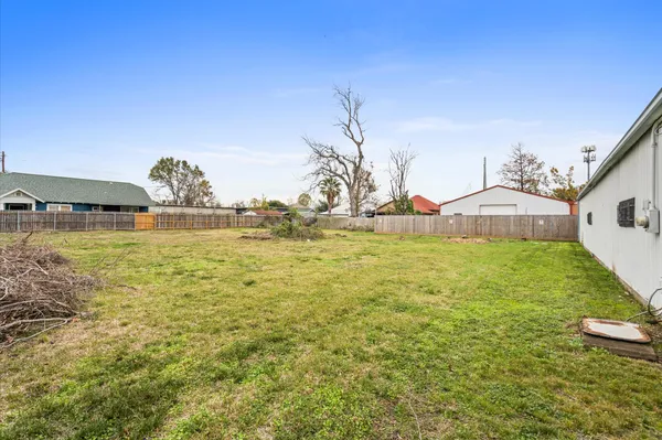 a view of swimming pool with outdoor seating and lake view