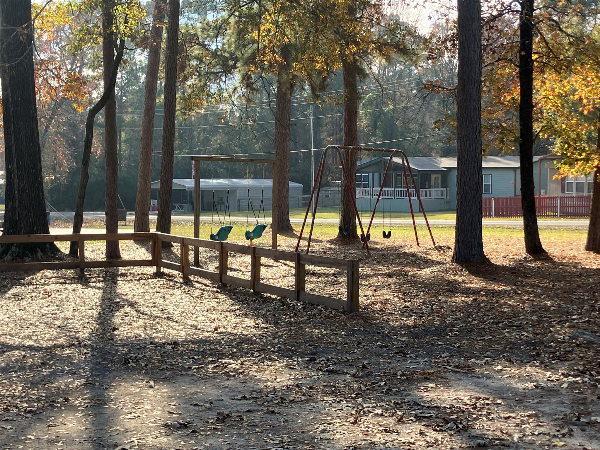 242 Elm Trail Trinity, TX 75862 - Photo 27 of 28 a view of a park with swings