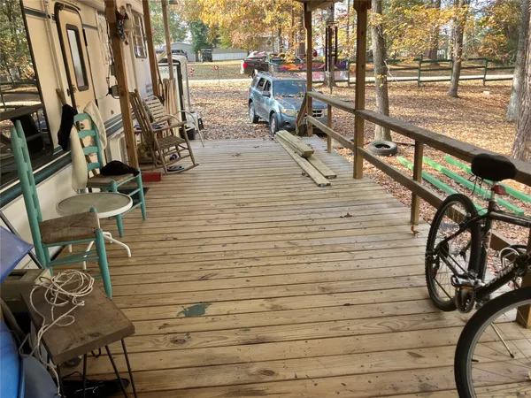 a room with furniture bookshelf and a window