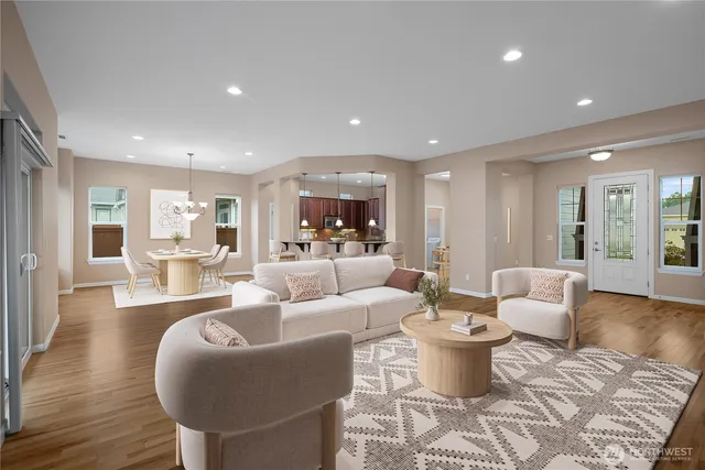 a living room with furniture and wooden floor