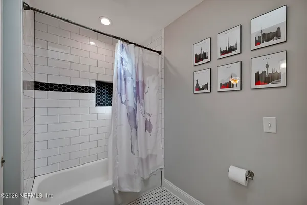a bathroom with a shower and a shower