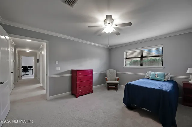 a bedroom with bed and window